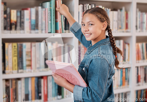 Image of Books, happy or girl in a library to search for knowledge or development for learning growth. High school, portrait or scholarship student searching, studying or reaching for education or information