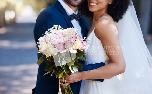 Image of Flowers, wedding and marriage with a bride and groom posing outdoor for a photograph at their celebration event or ceremony. Rose bouquet, love and romance with a newlywed black couple outside