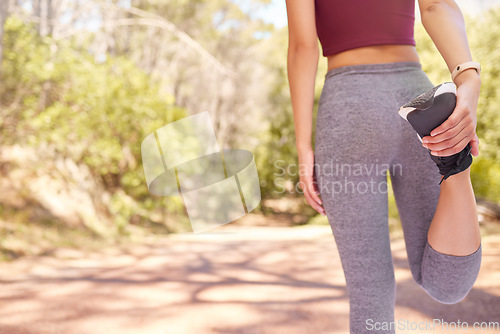 Image of Fitness, running and woman stretching legs on nature trail for workout, marathon training and exercise outdoors. Sports, athlete and girl start warm up for cardio, wellness and healthy lifestyle