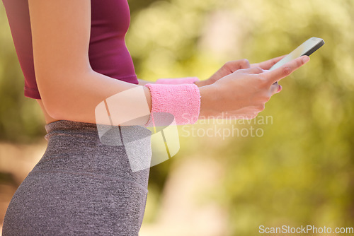 Image of Phone, fitness and woman hands in park to search digital workout online, reading notification or social media. Closeup sports person, cellphone and connection of training, health data and running app