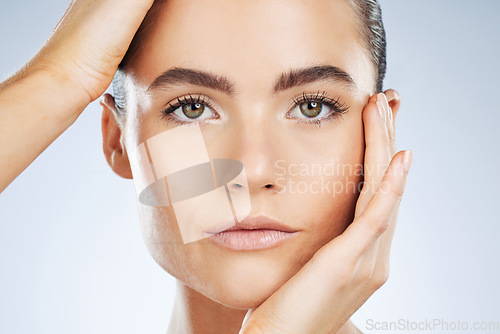 Image of Beauty, skincare and portrait of a woman with makeup isolated on a grey studio background. Glow, clean and face of a spa dermatology model with facial health, hydration and wellness on a backdrop