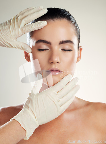 Image of Patient, beauty and plastic surgery with hands on woman face for dermatology collagen cosmetics. Headshot of skincare model person with cosmetologist gloves for cosmetic filler for facial skin lines