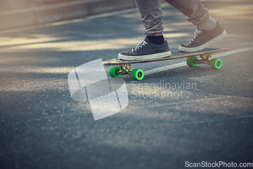 Image of Street, urban sports and feet on skateboard for teenage fun, alternative transport or fitness in city. Road, sneakers and free skateboarder riding board in park with balance and eco friendly travel.