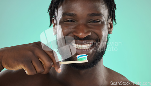 Image of Black man, face and toothbrush, happy portrait with smile for teeth whitening and cleaning mouth isolated on studio background. Fresh breath, beauty and hygiene with toothpaste, health and dental