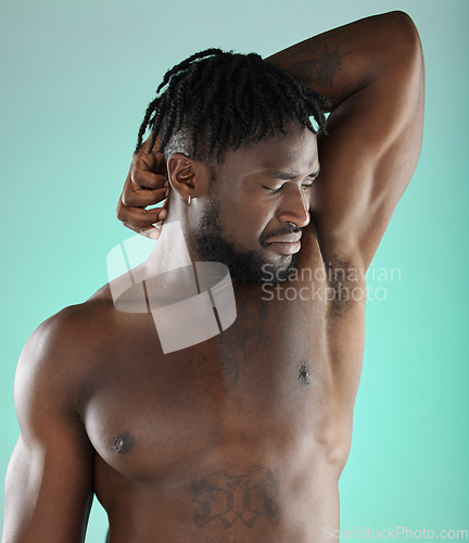 Image of Smelly, odor and black man disgusted by armpit scent or sweaty underarm isolated in a studio background. Natural, cosmetics and body care for unpleasant stink by a young, confident and African model