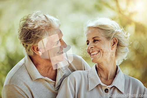 Image of Love, hug or happy old couple in nature bonding or laughing in a marriage partnership in retirement. Peace, senior man or romantic elderly woman hugging together on a calm relaxing holiday vacation