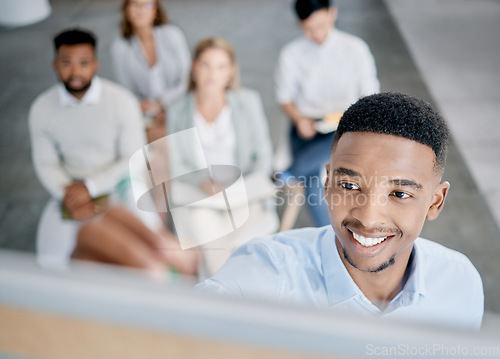 Image of Face, meeting and presentation with a business black man writing on a whiteboard while coaching his team. Training, growth and planning with a male employee giving a learning workshop for development