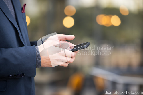 Image of Hands, travel or business man with phone for networking, social media or communication in London street. Search, zoom or manager with smartphone for research, internet or blog content review outdoor