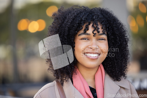 Image of Happy woman, portrait and city travel with a smile while outdoor on London street with freedom. Face of young black person with natural afro hair, beauty and fashion style during student holiday walk