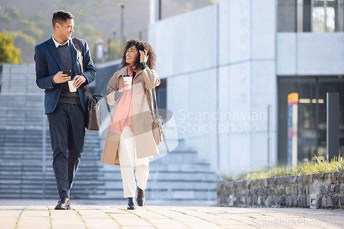 Image of Businessman, black woman and walking with coffee in city for planning, strategy or social discussion by office building. Teamwork, finance job and friends with discussion in urban metro for success
