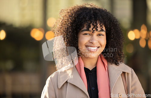 Image of Black woman, portrait and city travel with a happy smile while outdoor on London street with freedom. Smiling face of young person with natural afro hair, beauty and fashion style during holiday walk