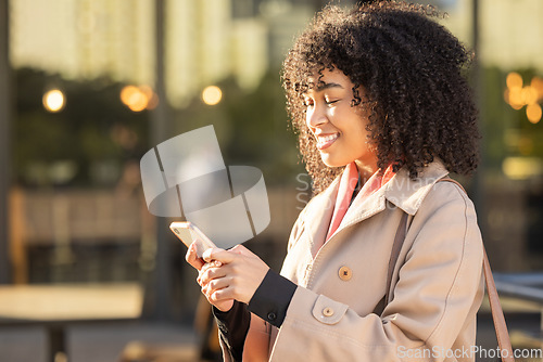 Image of Communication, travel or black woman with phone for networking, social media or search in London street. Happy, smile or professional on smartphone for research, internet or blog content outdoor