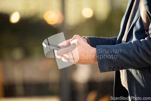 Image of Hands, networking or business man with phone for travel, social media or communication in London street. Search, zoom or professional on 5g smartphone for research, internet or blog content outdoor