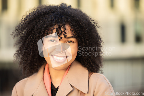 Image of Black woman, smile portrait and city travel while happy outdoor on London street with freedom. Face of young model person with natural afro hair, beauty and fashion style during a walk on holiday