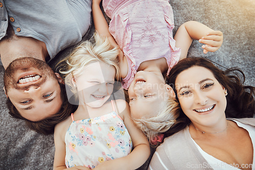 Image of Happy family, portrait and children with mom and father relaxing and smiling from top view from a park outdoors. Kids, overhead and excited parents with love, care and happiness bonding