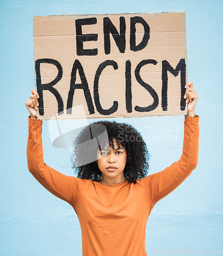 Image of Black woman protest, poster and angry at racism, fight for equality, human rights and freedom isolated on blue background. Global problem, social justice and revolution, anger in studio and politics