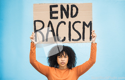 Image of Black woman protest, poster and anger at racism, fight for equality, human rights and freedom isolated on blue background. Global problem, social justice and revolution, angry in studio and politics