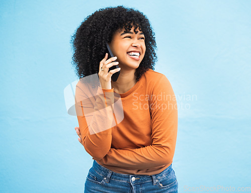 Image of Laughing black woman, afro and phone call on isolated blue background for funny gossip, comedy news or comic story. Smile, happy and student talking on mobile communication technology by wall mock up