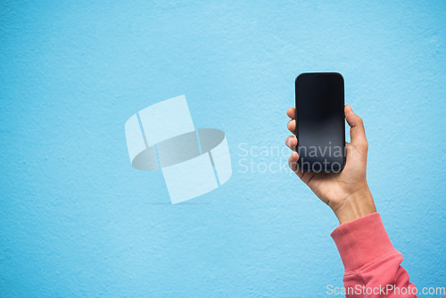 Image of Person, hand or phone screen mockup on isolated blue background in social media, app or blank web design. Zoom, student or model man with technology mock up for city contact communication or branding