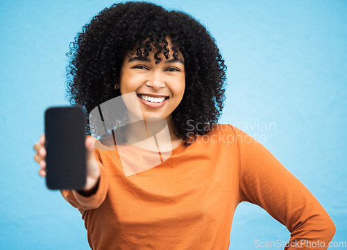 Image of Happy black woman, hand or portrait of phone screen mockup on isolated blue background in social media app or web design. Smile, person or student on technology mock up, city contact or communication
