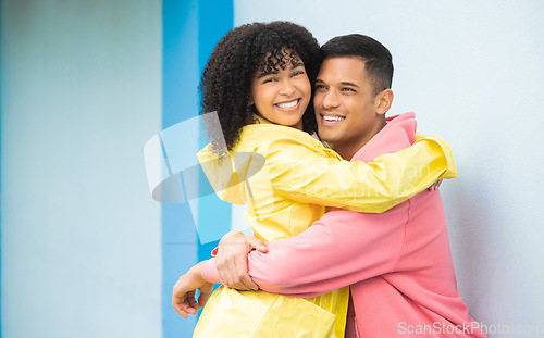 Image of Couple, smile and hug in portrait, happy mockup with love and commitment, partner isolated on blue background. Interracial relationship, commitment and together in studio with happy people and trust