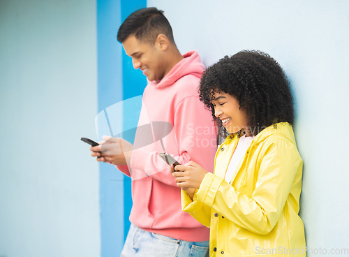 Image of Happy people, bonding or phone typing on isolated blue background on social media, couple dating app or city networking. Smile, man or afro woman on mobile technology or community communication web