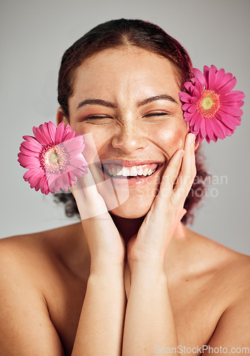 Image of Natural beauty, flowers and face of happy woman with eco friendly makeup, facial product or floral skincare glow. Sustainable cosmetics, spa salon girl and model smile isolated on studio background