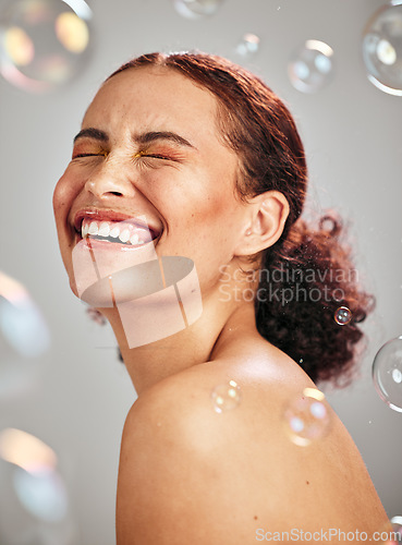 Image of Beauty, bubble and a happy woman in studio for skincare cosmetics, natural skin glow and dermatology. Facial makeup, health and wellness of aesthetic model person with luxury body product and peace