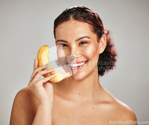 Image of Beauty, face portrait and woman with banana phone call for facial skincare glow, fruit detox or natural makeup. Wellness health product, nutritionist food or happy model isolated on studio background