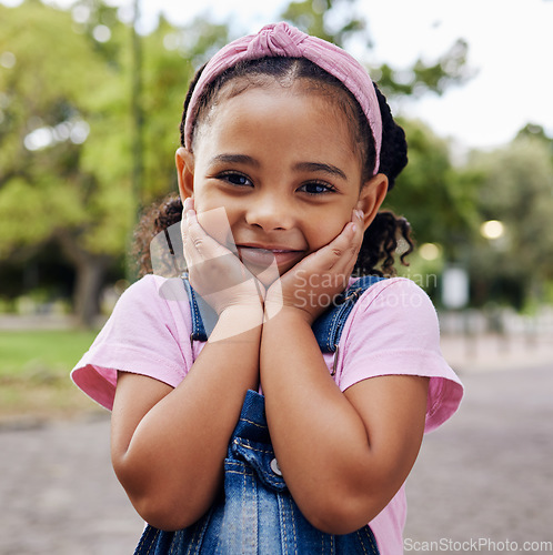 Image of Cute little girl, face and portrait smile in adorable pink casual fashion with denim at the outdoor park. Happy girly child smiling in happiness with innocent expression for holiday break in nature