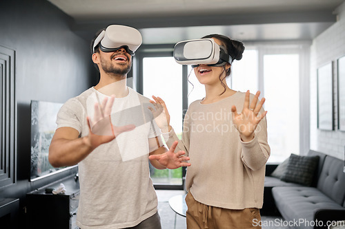 Image of Couple, futuristic tech and virtual reality, metaverse and gaming with VR goggles, ux and cyber fantasy with online game. Digital, 3d with gamer man and woman at home, wifi and technology innovation