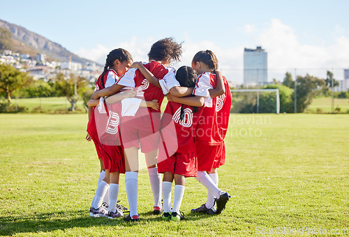 Image of Diversity, sports girl hug and soccer field training for youth competition match playing at stadium grass. Team, young athlete or player enjoy football teamwork or support world cup championship