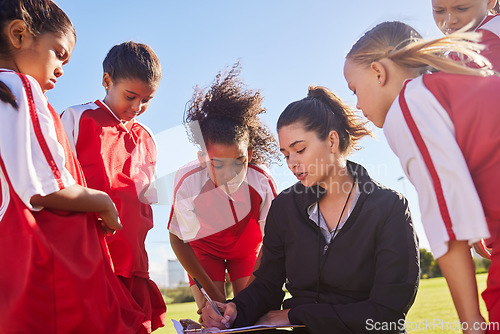 Image of Strategy, sports or coach with children for soccer planning, training or fitness goal in Canada. Team building, teamwork and woman coaching group of girls on football field for game, match or workout