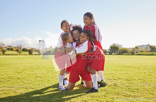 Image of Success, soccer or winner children team hug in stadium for sports exercise, sport game or workout training. Teamwork, Canada or kids in celebrating fitness, wellness or health goal on football field