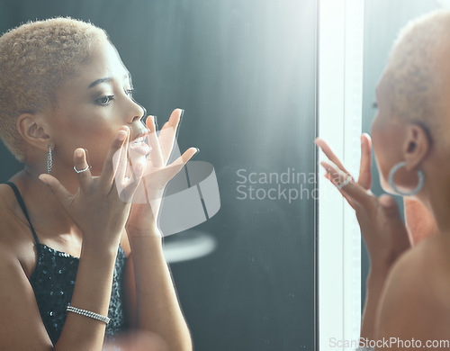 Image of Woman, mirror and nightclub bathroom for makeup, beauty and cosmetics with light, face and ready for party. Gen z girl, club and disco aesthetic with facial cosmetic, glow and shine at night event