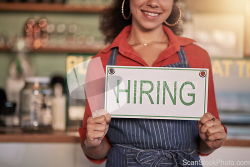 Image of Small business, hands or black woman with a hiring sign for job vacancy offer in cafe or coffee shop. Recruitment, marketing or happy entrepreneur smiles with an onborading message in store