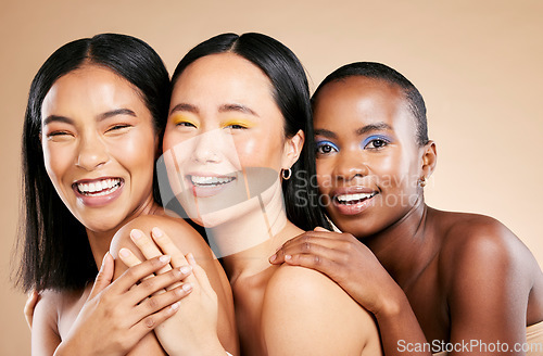 Image of Makeup, diversity and woman happiness together for support, facial wellness and cosmetics dermatology care in brown background studio. Model, smile and interracial beauty inclusion with skin glow