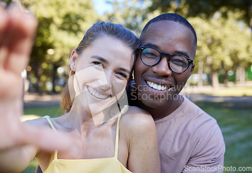 Image of Love, smile and selfie with interracial couple at park for relax, social media and peace on romantic date. Support, happy and quality time with black man and woman for bonding, calm and vacation