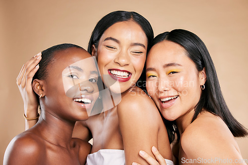 Image of Happy women, portrait smile and hug in beauty for skincare, cosmetics or makeup against a studio background. People, friends or models smiling in happiness or satisfaction for fun healthy treatment