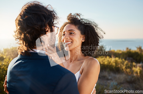 Image of Marriage, wedding and bride with groom on by ocean for ceremony, commitment and celebration of love. Romance, happiness and interracial couple bonding, hug and smile on mountain, nature and outdoors