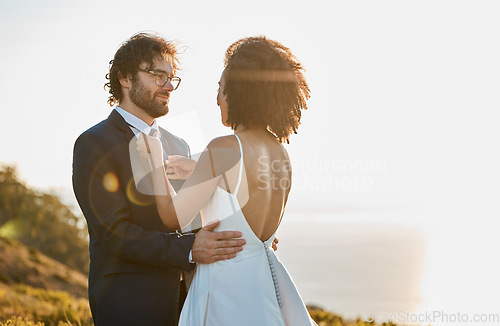 Image of Wedding, couple and bride with groom by ocean for marriage ceremony, commitment and celebration. Romance, love and interracial man and woman bonding, happy and smile on mountain, nature and outdoors