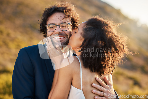 Image of Love, kiss and wedding with couple in nature for celebration, happiness and romance. Sunset, hug and affectionate with man and woman in embrace at countryside for happy, marriage and smile together