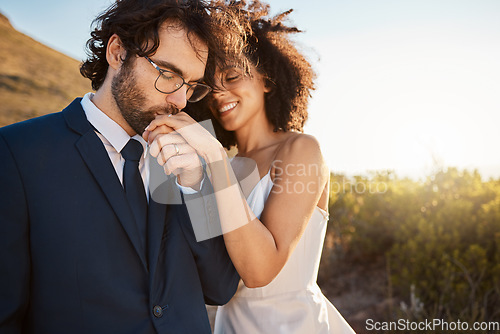 Image of Love, happy and wedding with couple in nature for celebration, happiness and romance. Sunset, hug and affectionate with husband and wife in embrace at countryside for kiss, marriage or smile together