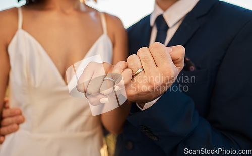 Image of Love, wedding or hands of a couple promise trust, support or commitment in a romantic celebration event. Interracial marriage. Zoom, black woman and man together as bride and groom in a partnership