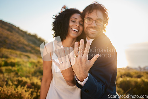 Image of Ring, wedding or a couple of friends in nature on a romantic celebration in an interracial marriage. Hands, black woman or happy man smile with pride as bride and groom celebrate together at sunset