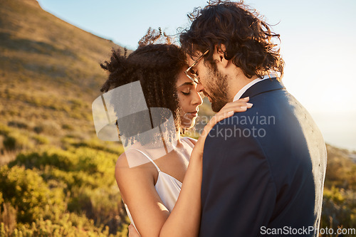 Image of Wedding, interracial couple hug and mountains of people outdoor in nature for marriage and save the date. Trust, love celebration and bride with man for commitment, care and feeling calm together