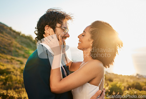 Image of Love, wedding and couple on mountain kiss for marriage ceremony, commitment and celebration. Affection, romance and interracial bride and groom bonding, happy and smile with ocean sunset in Italy