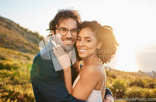 Image of Portrait, wedding couple and interracial marriage hug in nature, happy and excited while celebrating love, beginning and romance. Face, bride and groom by black woman and man embrace, sweet and smile