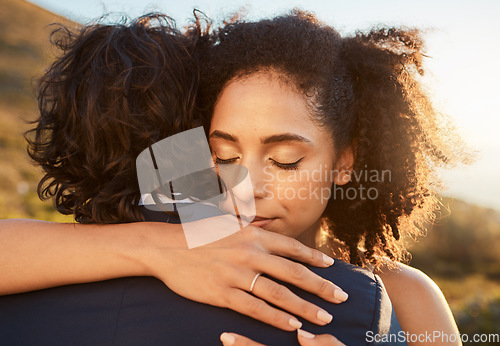 Image of Wedding, black woman and man hug at sunset together for care, love and support for married life. Romantic, commitment and marriage event of young people in Cape Town, South Africa nature.