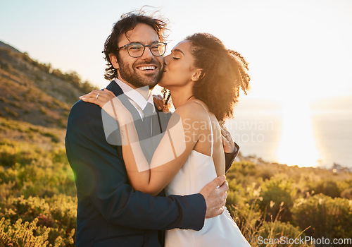 Image of Love, kiss and wedding with couple in nature for celebration, happiness and romance. Sunset, hug and affectionate with man and woman in embrace at countryside for happy, marriage and smile together